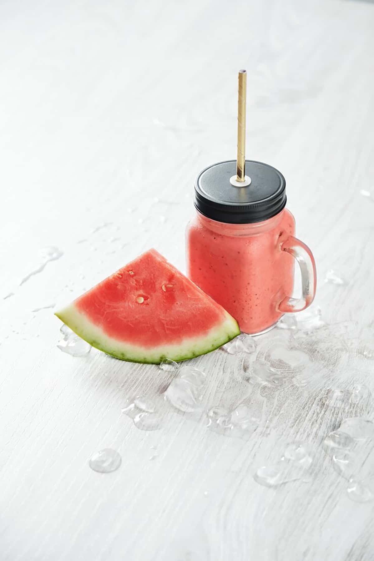 Watermelon and water bottle after a workout session